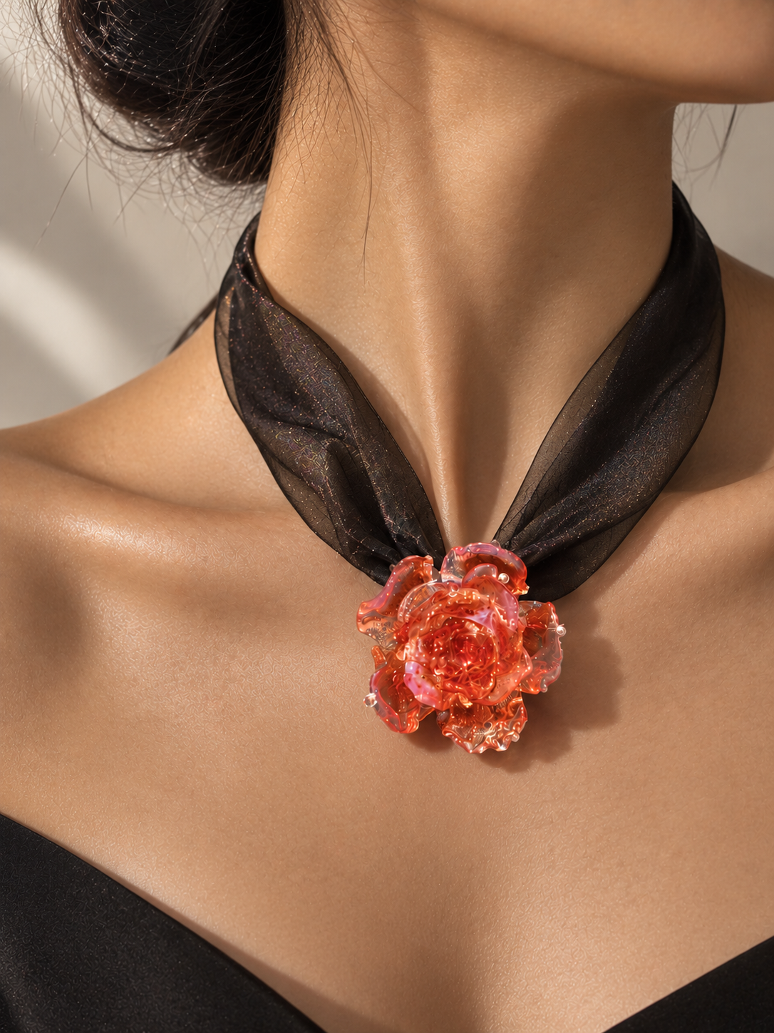 Close-up of a model wearing the REALONETARA Magic Red liuli rose flower necklace with black organza.