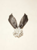 Handcrafted white Liuli glass iris choker necklace on white background, black organza ribbon chain with lobster clasp