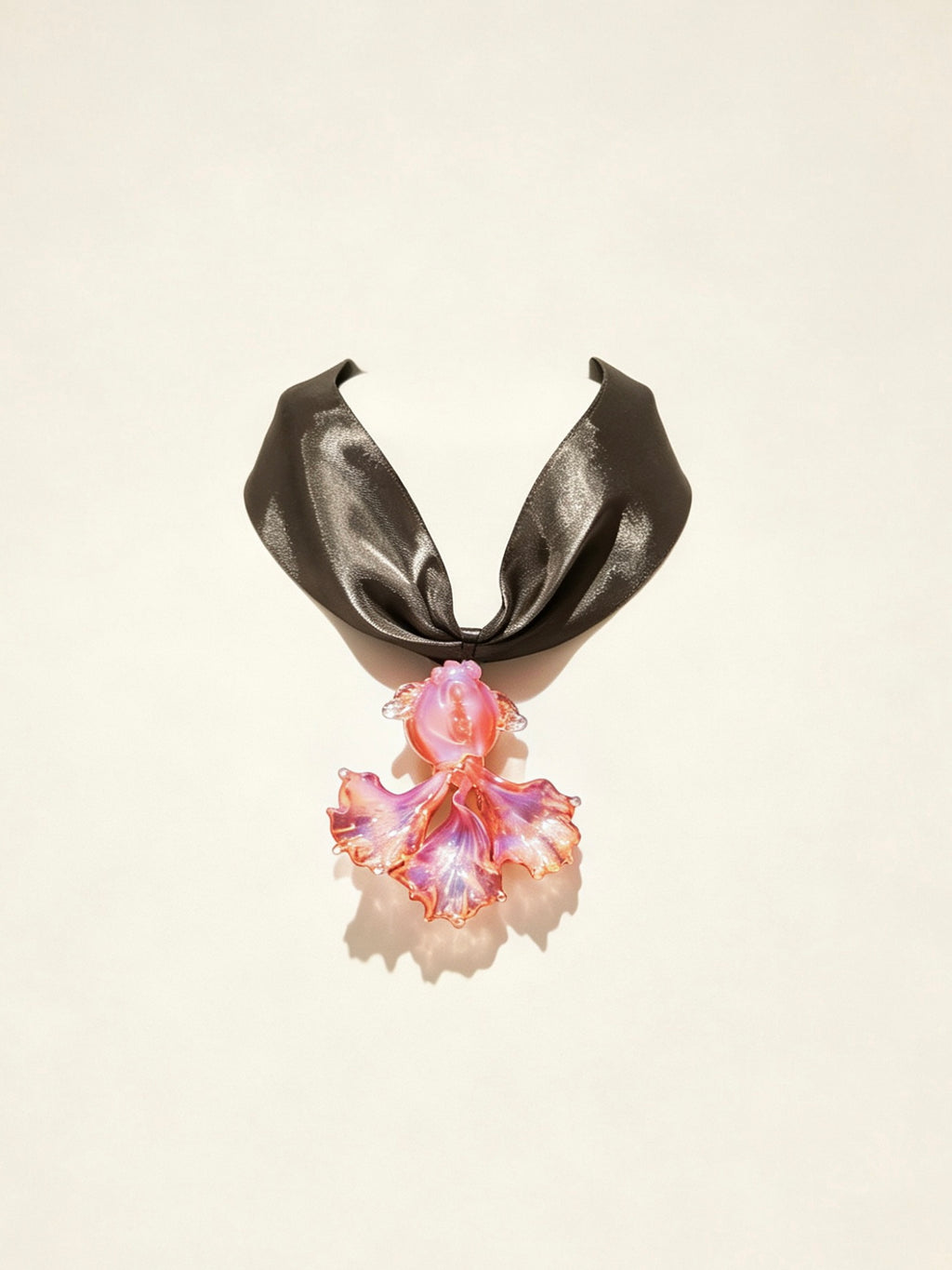 Handcrafted pink Liuli glass koi fish choker necklace on white background, black organza ribbon chain with lobster clasp