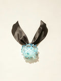 Handcrafted blue Liuli glass rose choker necklace on white background, black organza ribbon chain with lobster clasp