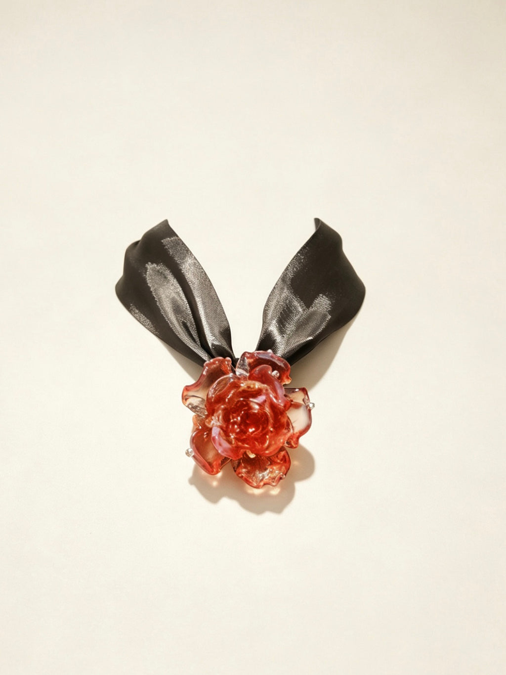 Handcrafted red Liuli glass rose choker necklace on white background, black organza ribbon chain with lobster clasp