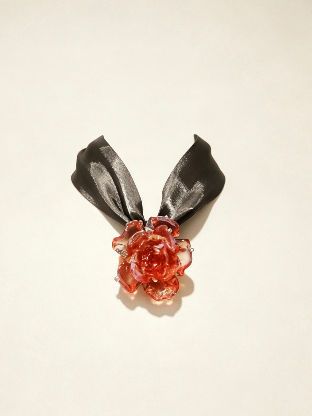 Handcrafted red Liuli glass rose choker necklace on white background, black organza ribbon chain with lobster clasp