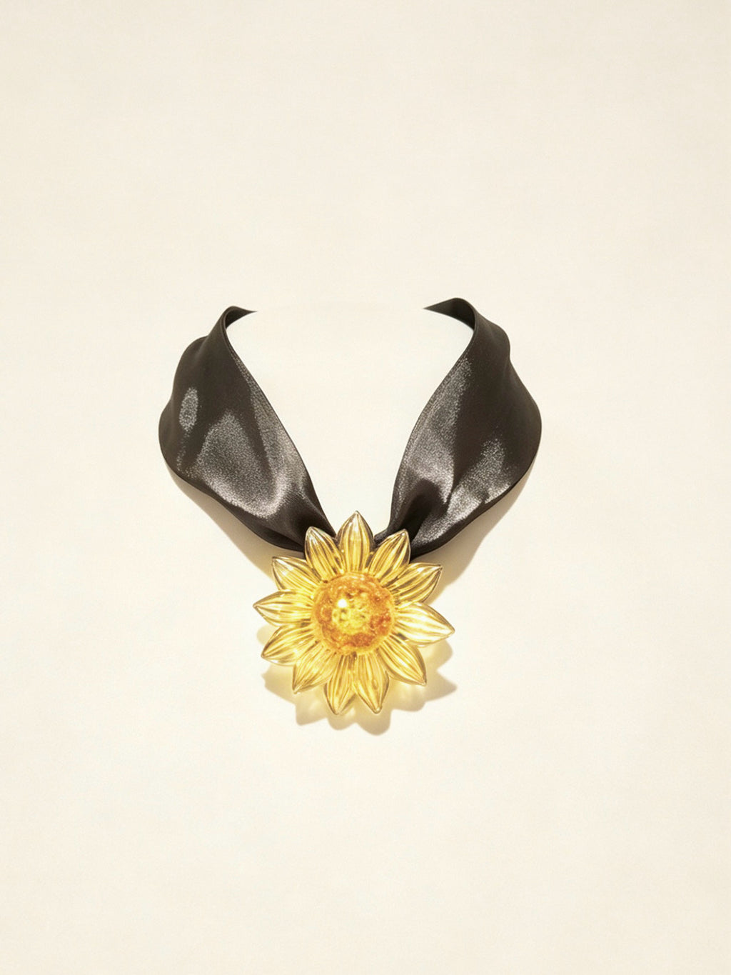 Handcrafted yellow gold Liuli glass sunflower choker necklace on white background, black organza ribbon chain with lobster clasp
