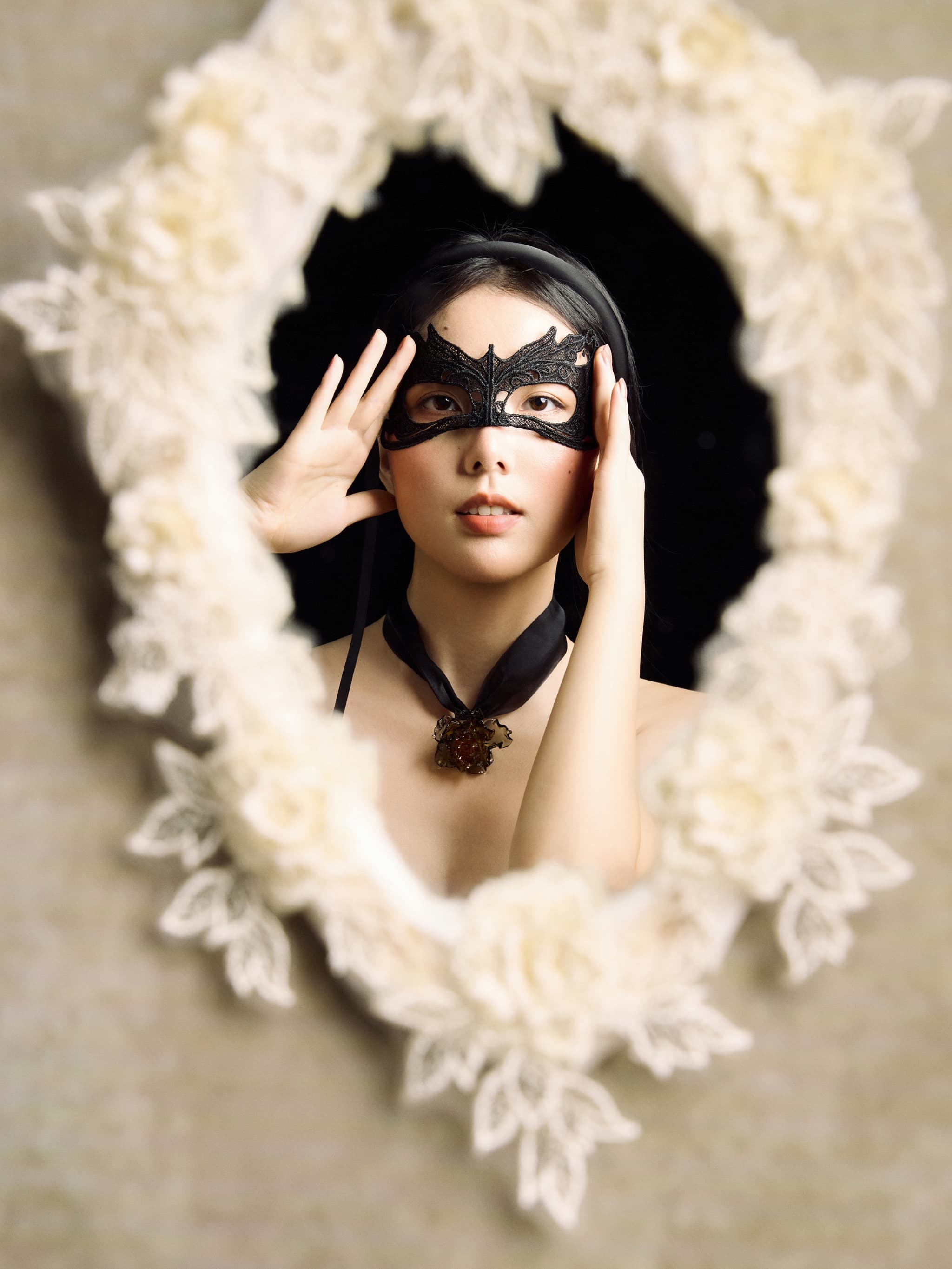 Model wearing Noble Lady Green Gold Liuli Glass Rose Choker Necklace, standing before a lace-framed mirror, holding a black eye mask, gazing directly at camera