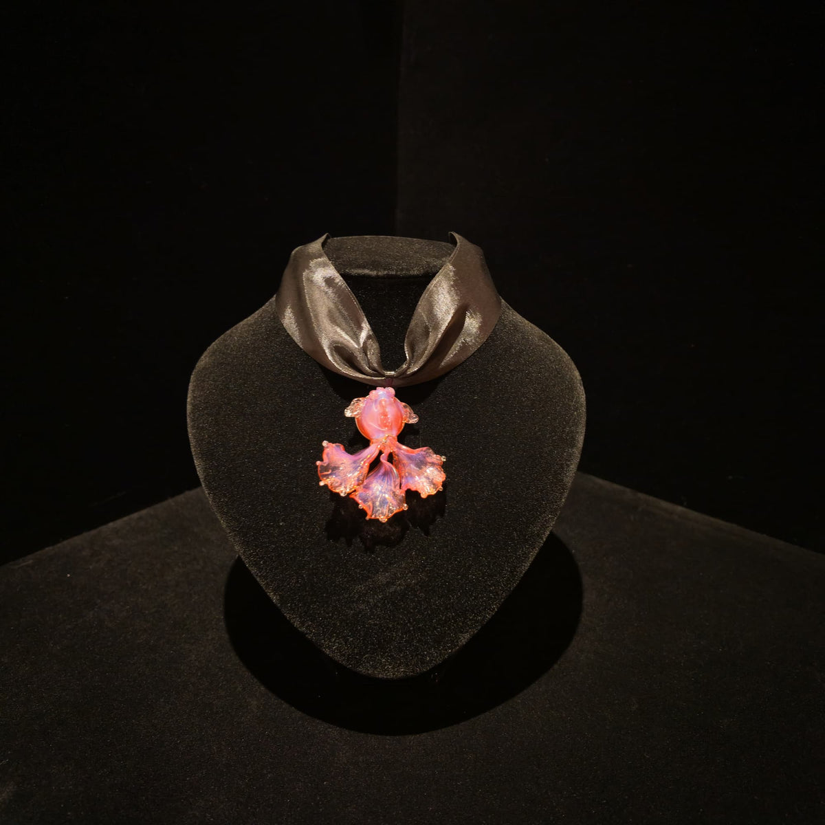 REALONETARA Koi Fish Pink Liuli necklace displayed on a black jewelry bust.