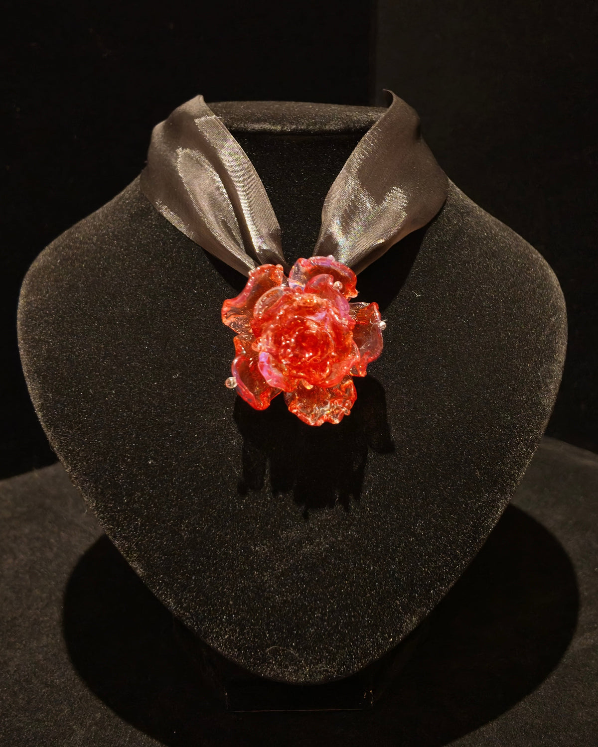 REALONETARA Magical Red Rose Liuli flower necklace displayed on a black jewelry bust.