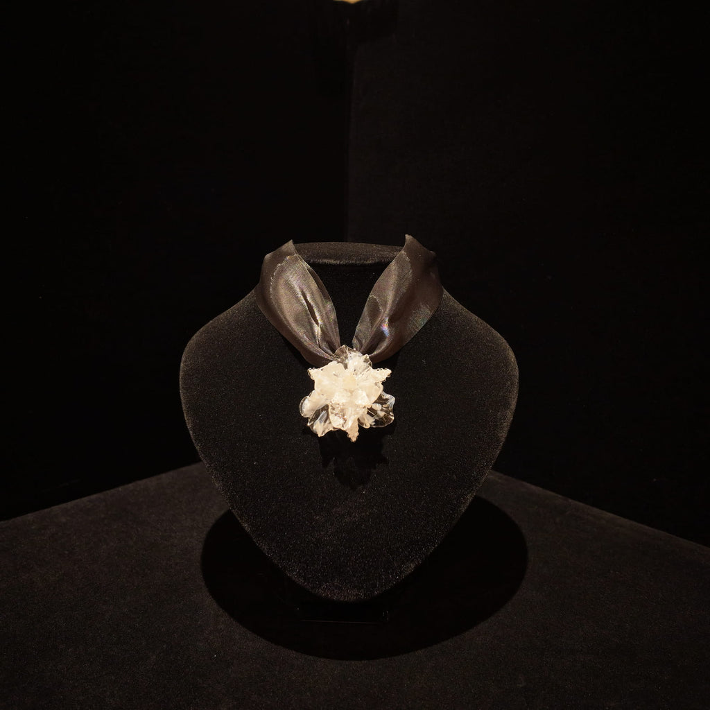 REALONETARA Moonlight White Iris Flower Liuli necklace displayed on a black jewelry bust.