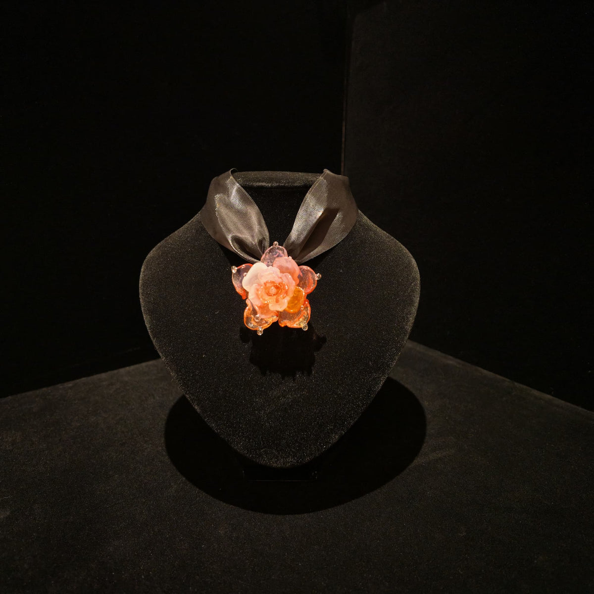 REALONETARA Pink Lady Rose Flower Liuli necklace displayed on a black jewelry bust.