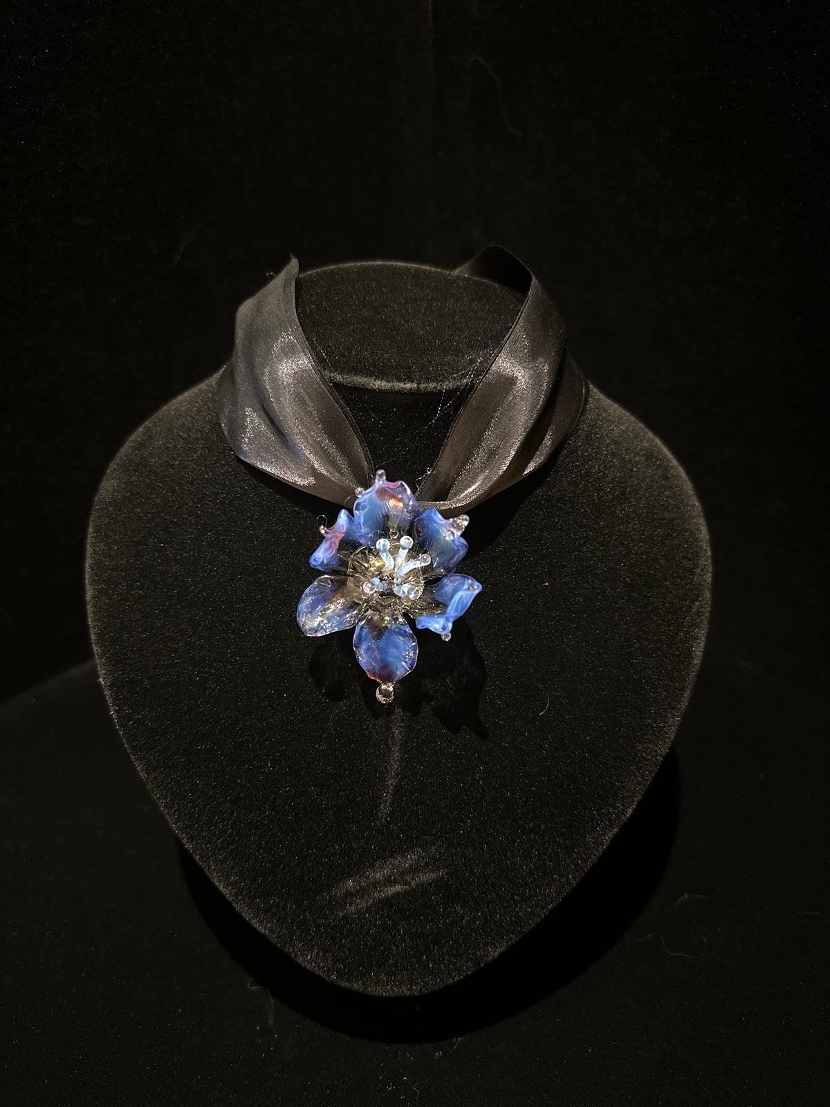 REALONETARA Queen Purple Blue Orchid Flower Liuli necklace displayed on a black jewelry bust.